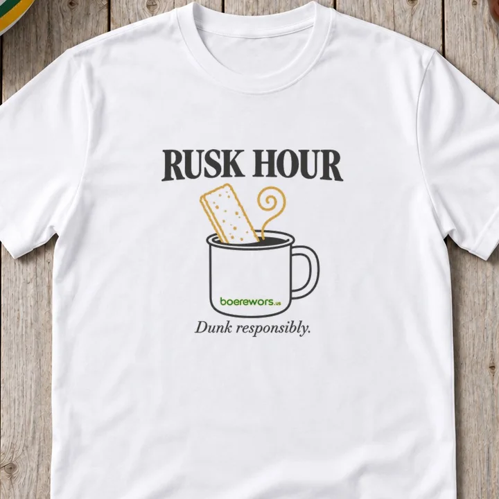 White tee printed with a rusk dunked in a coffee mug: Rusk Hour. Dunk responsibly.