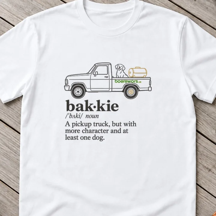 White tee printed with dictionary entry with a pickup truck and a dog: bakkie, a pickup truck but with more character.