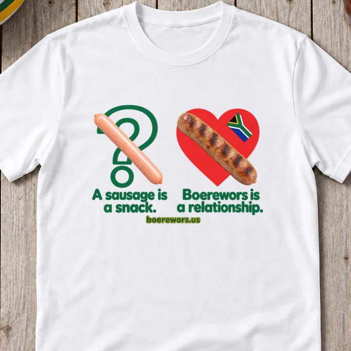 White tee printed with a vienna sausage over a question mark and grilled boerewors over a red heart with the South African flag: A sausage is a snack. Boerewors is a relationship.